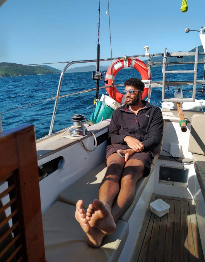 Steven working hard sailing, Micky (wind vane) is steering Photo Ray Penson