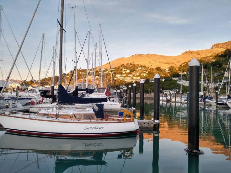 Sunrise hitting the hills above Lyttleton Te Ana Marina Photo Ray Penson