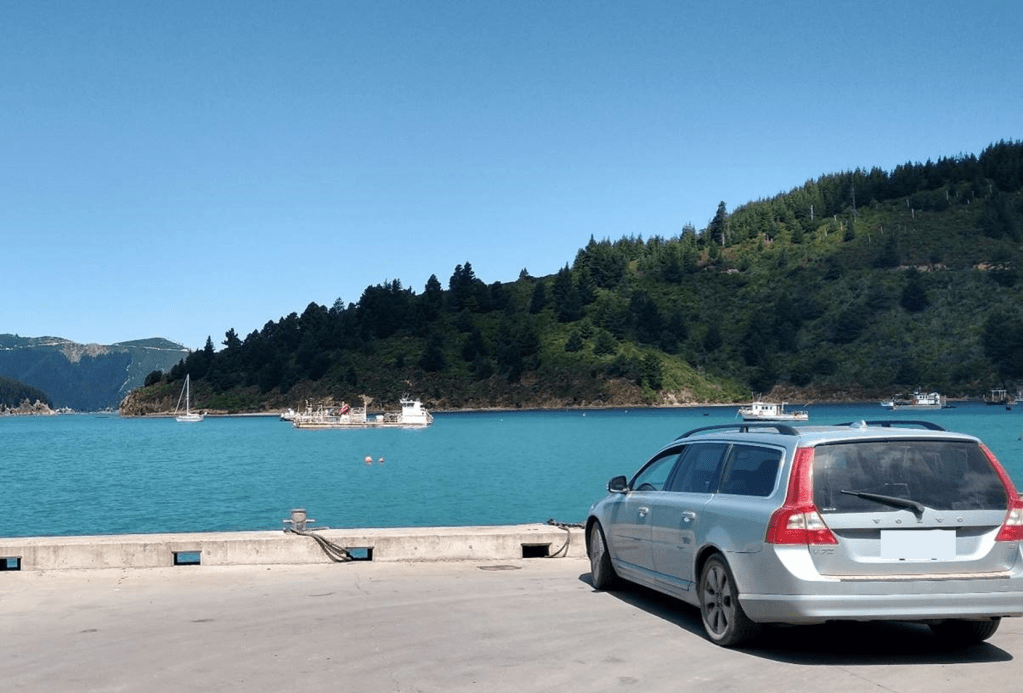 Trusty Volvo with Truce in the background at Oyster Bay Photo Ray Penson.