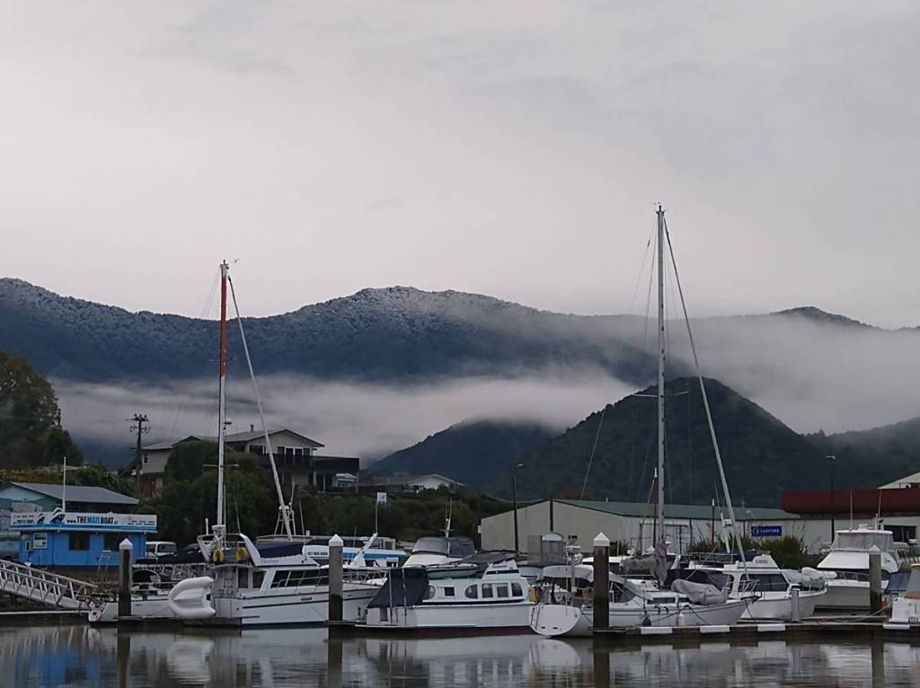 First dusting of snow on the hills, Havelock Marina. Photo Ray Penson