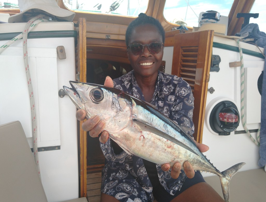 Ngozi with freshly caught diner. Photo Ray Penson