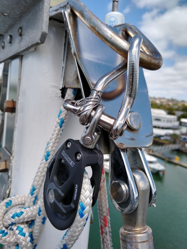 Mast is up and checking again. Photo Ray Penson