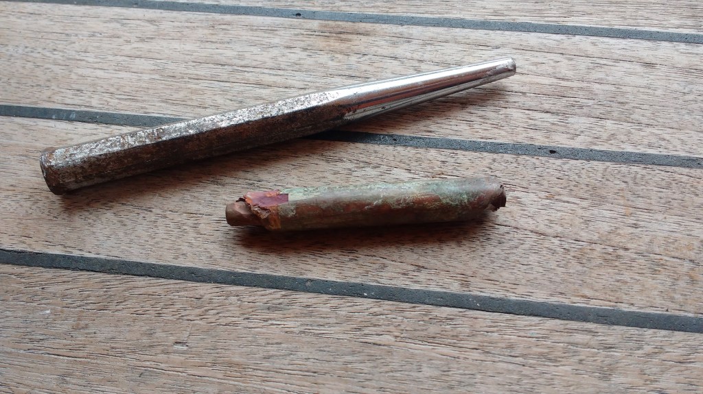 Badly corroded Copper shoe pin. Photo Ray Penson