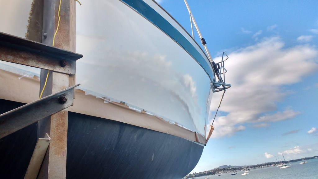 First Coat, New Paint on topsides. Photo Ray Penson