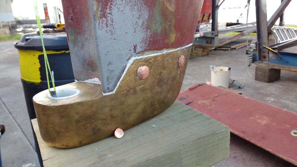 Paining over rivets to fix the shoe. Photo Ray Penson