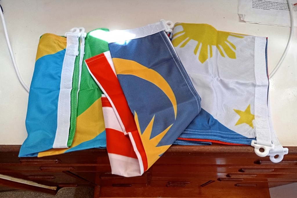 Three new country flags arrived from Tokopedia. Photo Ray Penson