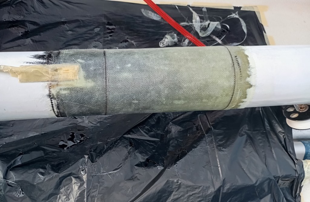 Four Layers Epoxy and Glass wrap repairs to Spinnaker Pole. Photo Ray Penson