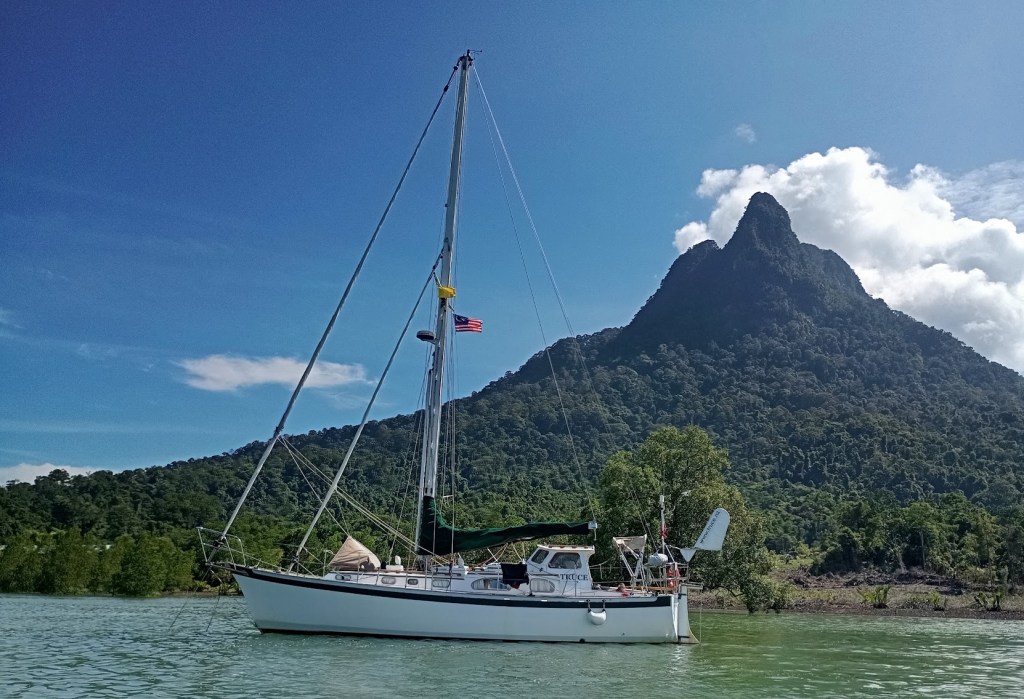 Truce at anchor with Mount Santubong behind. Photo Ray Penson