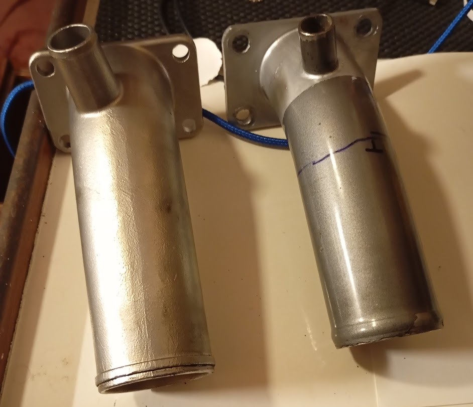 Old right and new left Exhaust Elbows. Photo Ray Penson