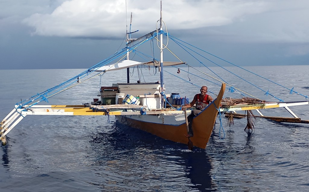 Chatting with local fishermen in the Celebes Sea. Photo Ray Penson
