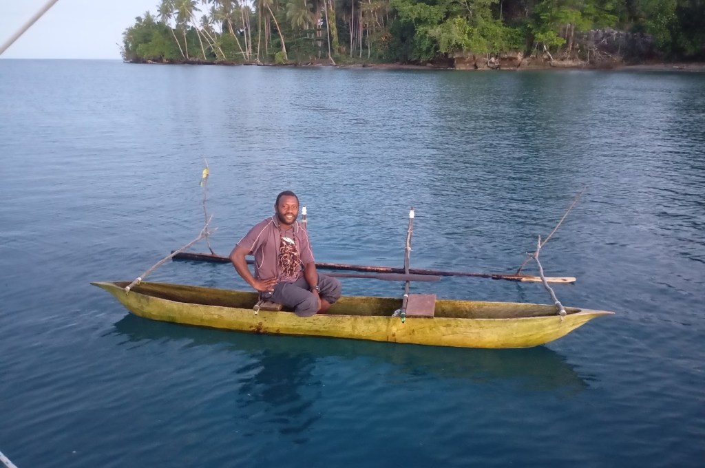 This Gentleman came out to the anchorage in the morning to shake me down for anchoring fees. First he was the headman, then the schoolteacher and finally the priest. I informed him it was against my religion to pay anchoring fees. Photo Ray Penson